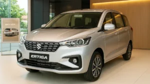 Maruti Ertiga 2025 front view showcasing the new chrome grille and dual-tone alloy wheels
