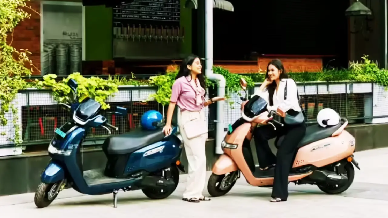 TVS iQube electric scooter 212 km range touchscreen college student