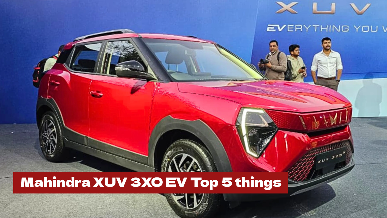 Front three-quarter view of the new Mahindra XUV 3XO EV in Nebula Blue with copper accents and closed grille